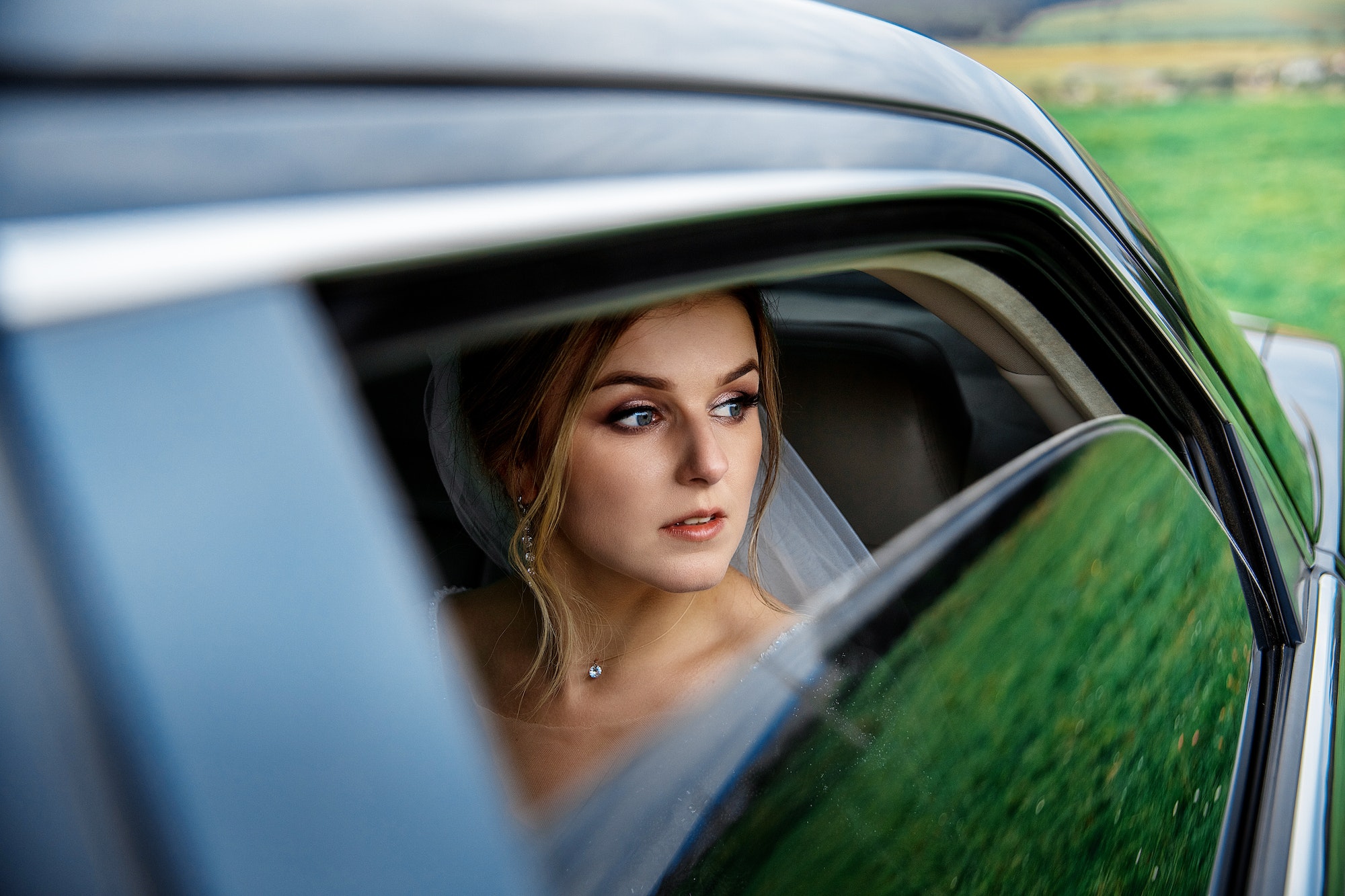 photo of a woman in an open car window